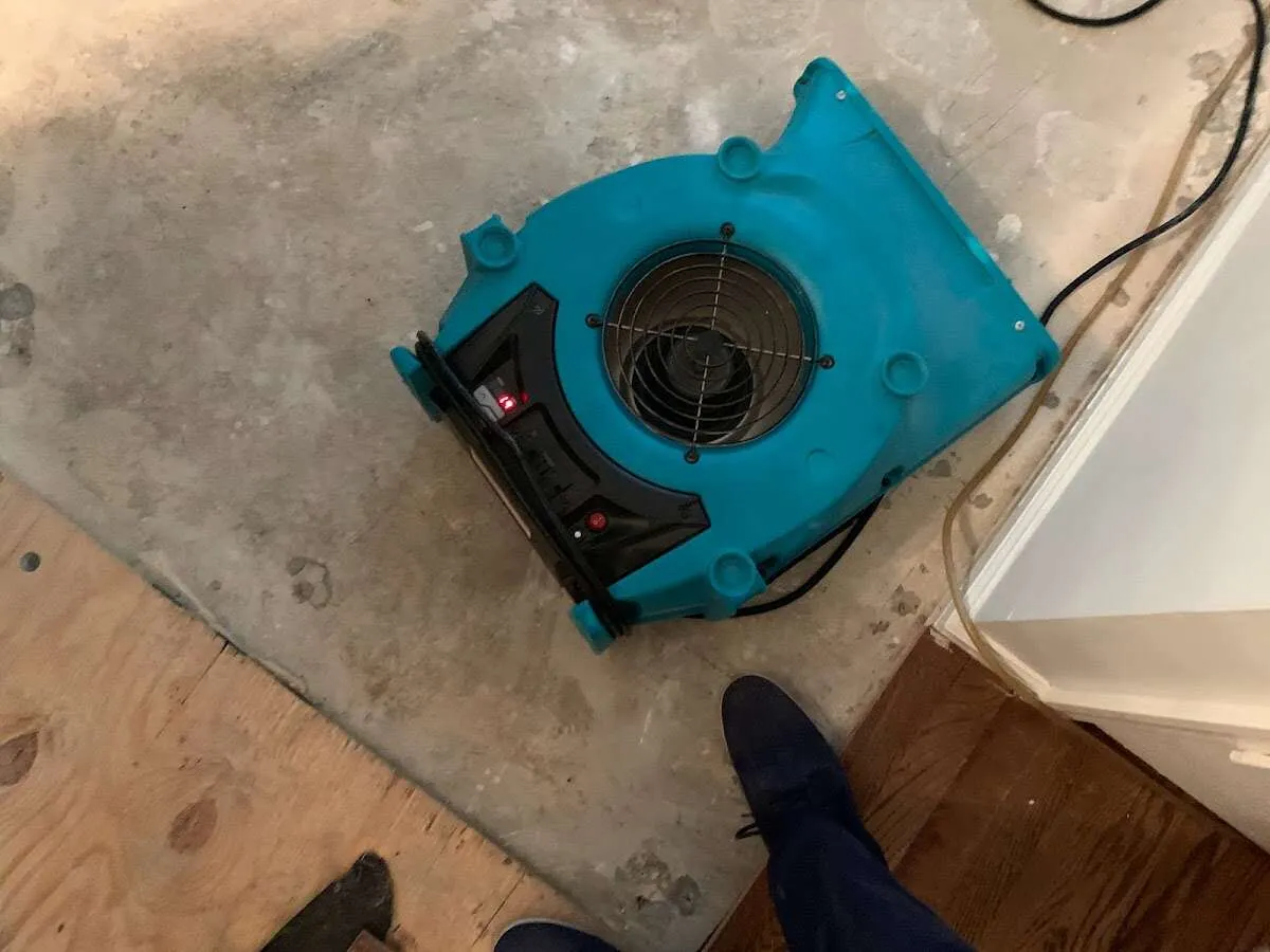 Air mover drying subfloor during Leak Detection & Repair in Green Valley